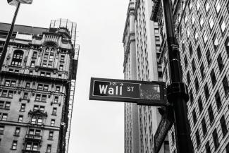 grayscale photo of 1-21 Wall street signage by Chris Li courtesy of Unsplash.